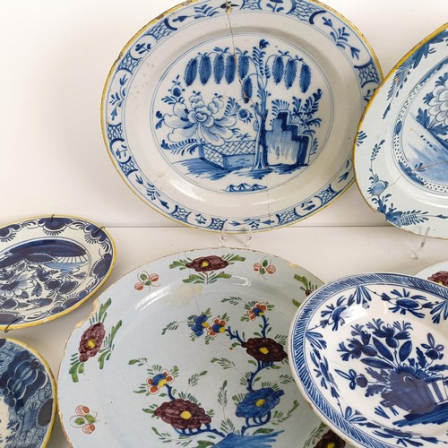 1409 - A Delft blue and white plate, 35 cm diameter, and assorted other Delft plates (12)