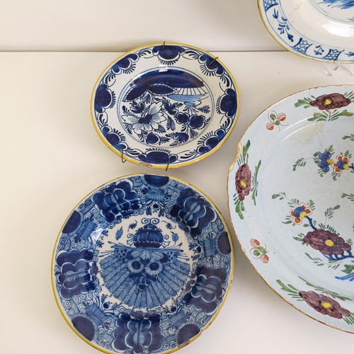 1409 - A Delft blue and white plate, 35 cm diameter, and assorted other Delft plates (12)