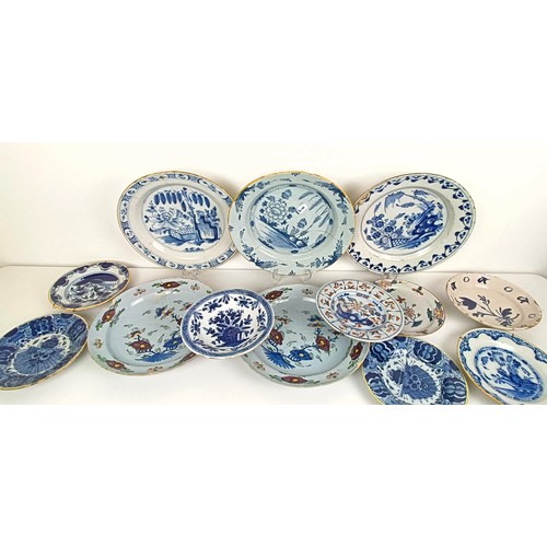 1409 - A Delft blue and white plate, 35 cm diameter, and assorted other Delft plates (12)