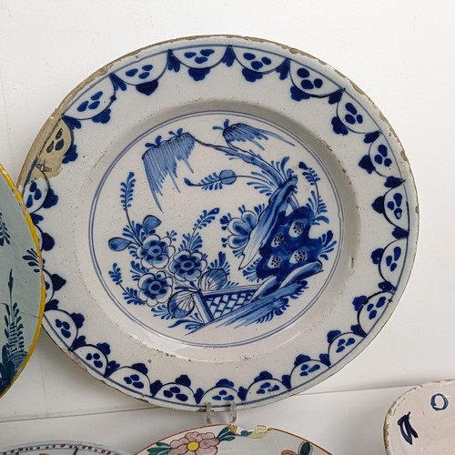 1409 - A Delft blue and white plate, 35 cm diameter, and assorted other Delft plates (12)