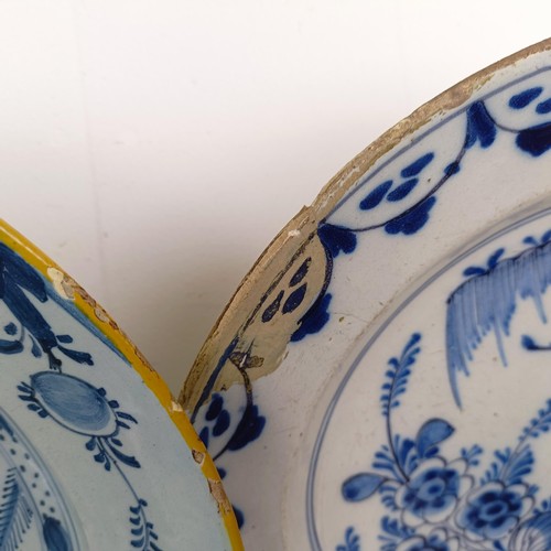 1409 - A Delft blue and white plate, 35 cm diameter, and assorted other Delft plates (12)