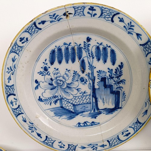 1409 - A Delft blue and white plate, 35 cm diameter, and assorted other Delft plates (12)