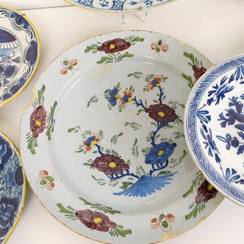 1409 - A Delft blue and white plate, 35 cm diameter, and assorted other Delft plates (12)