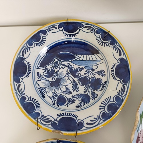 1409 - A Delft blue and white plate, 35 cm diameter, and assorted other Delft plates (12)