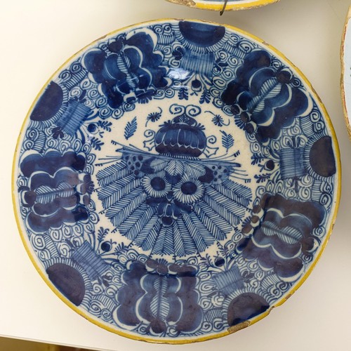 1409 - A Delft blue and white plate, 35 cm diameter, and assorted other Delft plates (12)