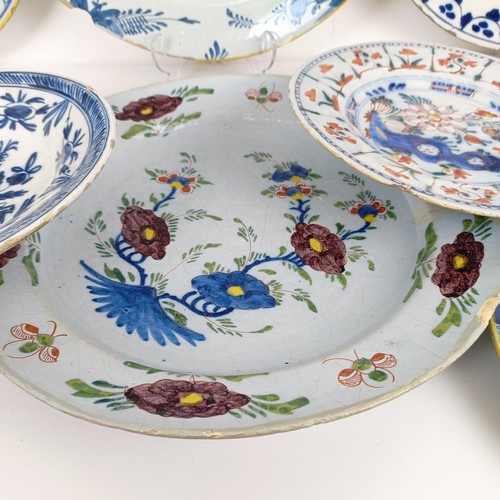 1409 - A Delft blue and white plate, 35 cm diameter, and assorted other Delft plates (12)