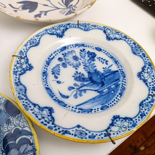 1409 - A Delft blue and white plate, 35 cm diameter, and assorted other Delft plates (12)