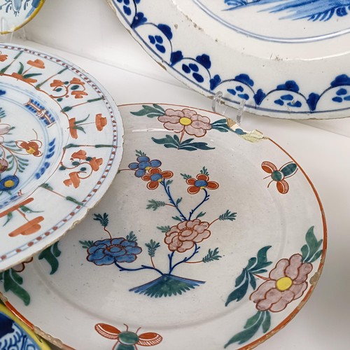 1409 - A Delft blue and white plate, 35 cm diameter, and assorted other Delft plates (12)