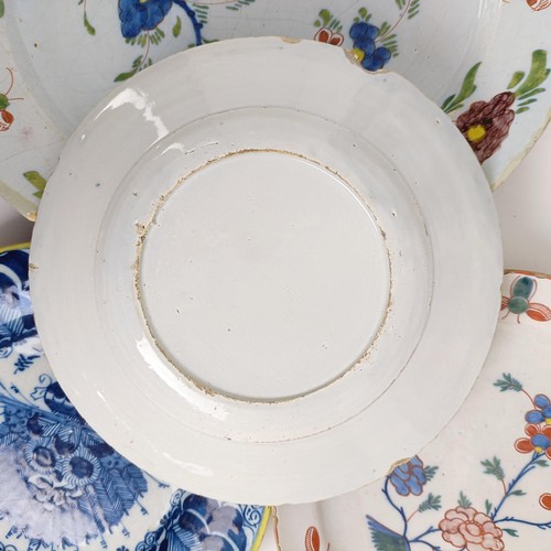 1409 - A Delft blue and white plate, 35 cm diameter, and assorted other Delft plates (12)