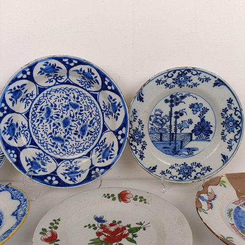 1411 - A Delft blue and white plate, 23 cm wide, and assorted other Delft plates (11)