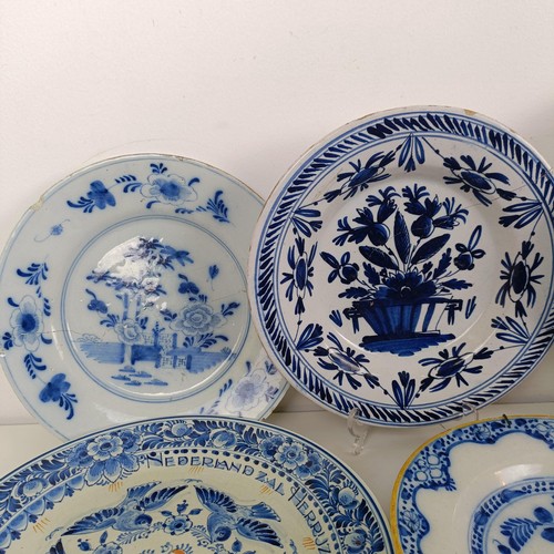 1411 - A Delft blue and white plate, 23 cm wide, and assorted other Delft plates (11)