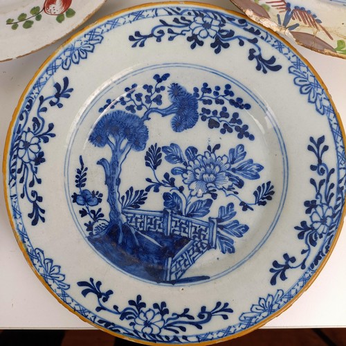 1411 - A Delft blue and white plate, 23 cm wide, and assorted other Delft plates (11)