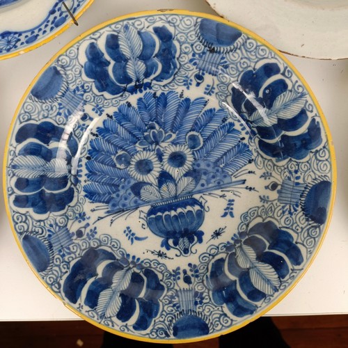 1411 - A Delft blue and white plate, 23 cm wide, and assorted other Delft plates (11)