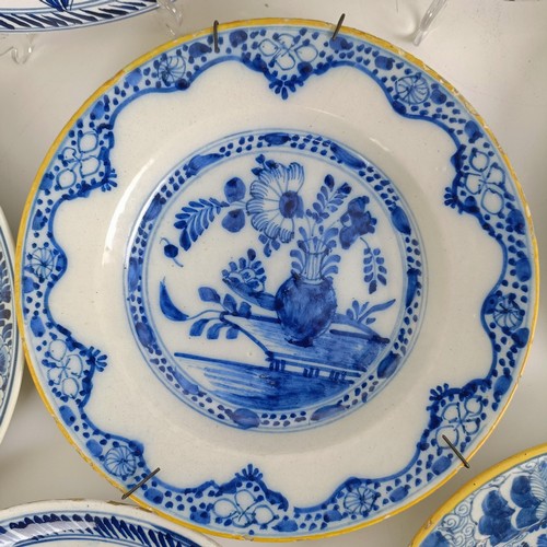 1411 - A Delft blue and white plate, 23 cm wide, and assorted other Delft plates (11)