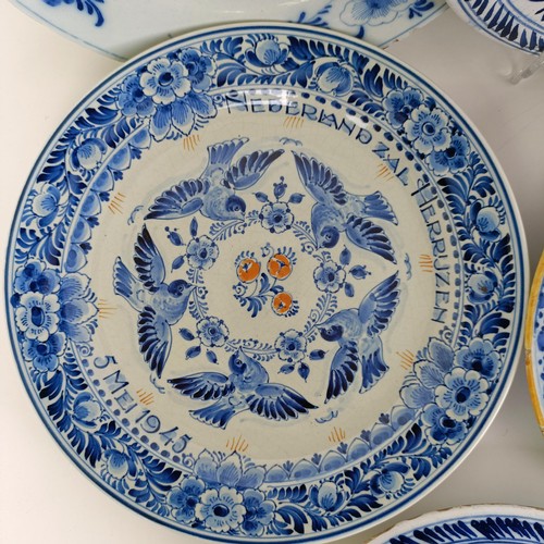 1411 - A Delft blue and white plate, 23 cm wide, and assorted other Delft plates (11)