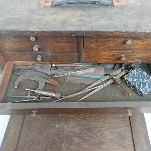 1498 - Assorted clock makers and other tools, in a cabinet 44 cm wide