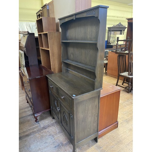 1633 - A yew wood bookcase, 74 cm wide, a teak chest, three chests of drawers, a stool, a mirror, an oak si... 