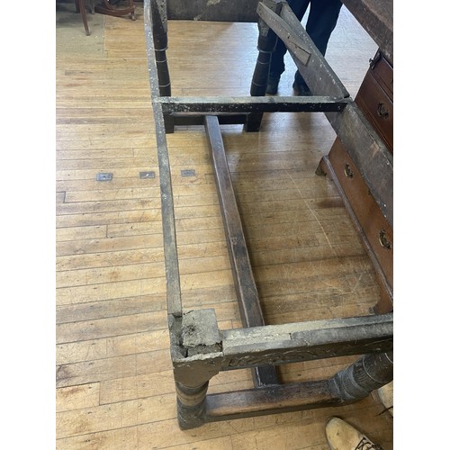 1652 - An 18th century style oak refectory table, the plank top above a carved frieze, 202 x 76 cm