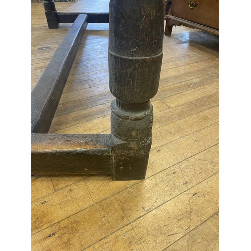 1652 - An 18th century style oak refectory table, the plank top above a carved frieze, 202 x 76 cm