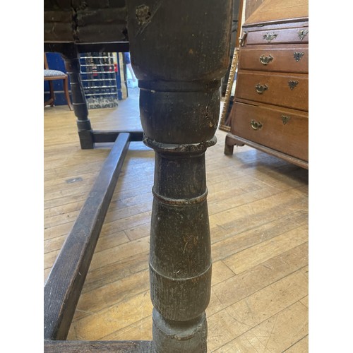 1652 - An 18th century style oak refectory table, the plank top above a carved frieze, 202 x 76 cm