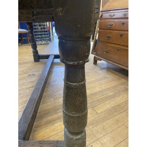 1652 - An 18th century style oak refectory table, the plank top above a carved frieze, 202 x 76 cm