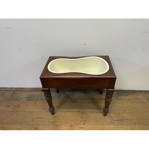 1605 - A mahogany bidet, on tapering legs, 53 cm wide