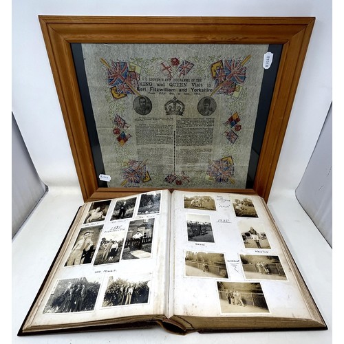 1383 - An early 20th century photograph album, with a carved wooden cover, contents of family portraits and... 