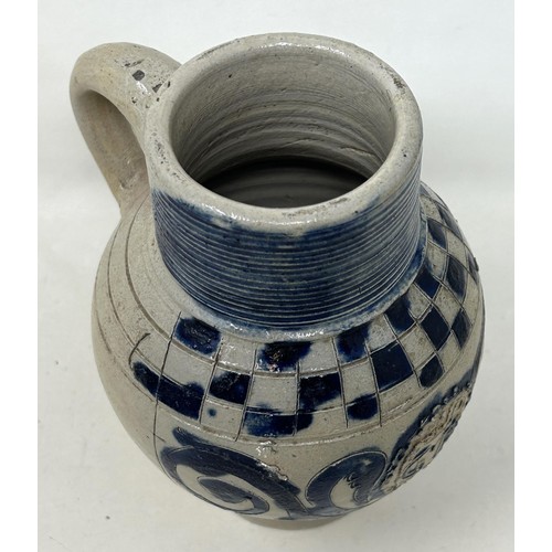 1445 - An 18th century German Westerwald stoneware jug, with GR cypher, 15 cm high