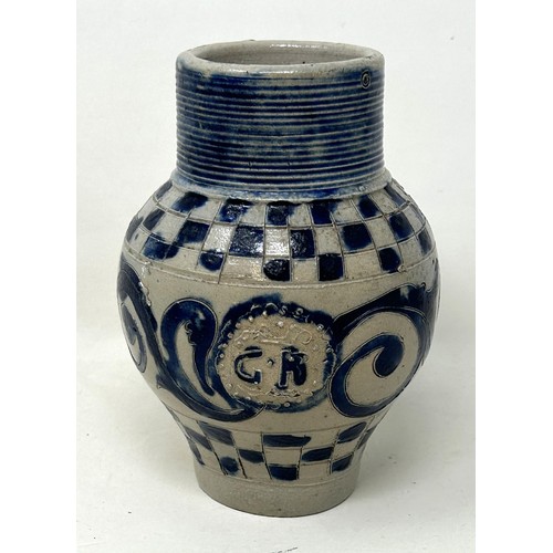 1445 - An 18th century German Westerwald stoneware jug, with GR cypher, 15 cm high