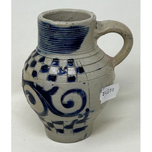 1445 - An 18th century German Westerwald stoneware jug, with GR cypher, 15 cm high