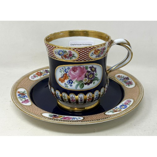 1452 - A late 19th century Meissen porcelain cup and a matching plate, with floral deocration on a blue gro... 