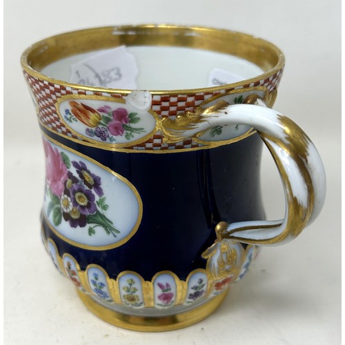 1452 - A late 19th century Meissen porcelain cup and a matching plate, with floral deocration on a blue gro... 