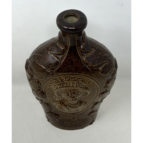 1462 - A 19th century brown glazed bottle, decorated portrait of The Duchess of Kent and Queen Victoria, 21... 