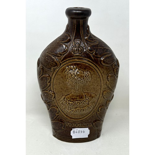 1462 - A 19th century brown glazed bottle, decorated portrait of The Duchess of Kent and Queen Victoria, 21... 