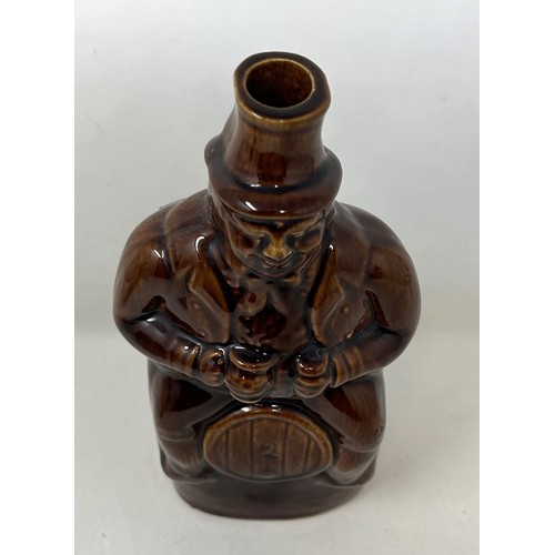 1463 - A 19th century brown glazed novelty bottle, 22 cm high