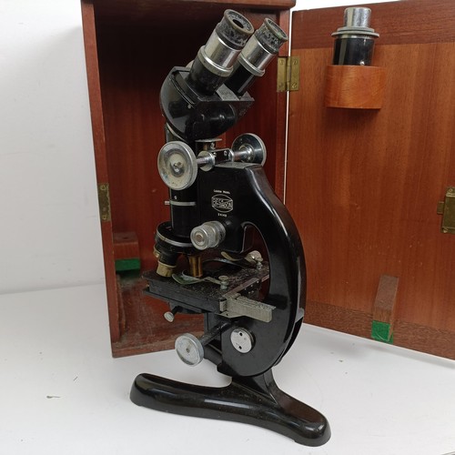 1497 - A Beck microscope, model 48, cased and assorted cameras (box)