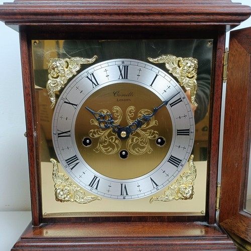 1522 - A reproduction mantel clock, in a mahogany case, 38 cm high, and three other clocks (4)