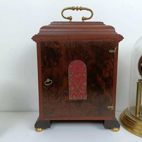 1522 - A reproduction mantel clock, in a mahogany case, 38 cm high, and three other clocks (4)