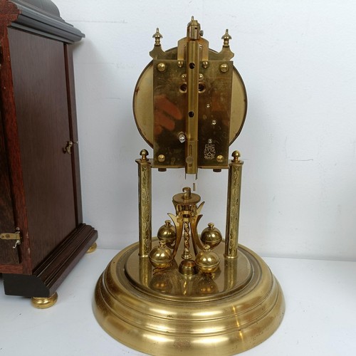 1522 - A reproduction mantel clock, in a mahogany case, 38 cm high, and three other clocks (4)