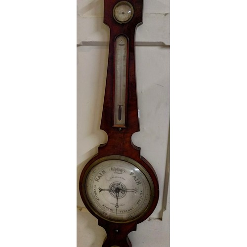 1524 - A Victorian wheel barometer, by J Hughes, London, with silvered dials, in a rosewood case, 114 cm hi... 