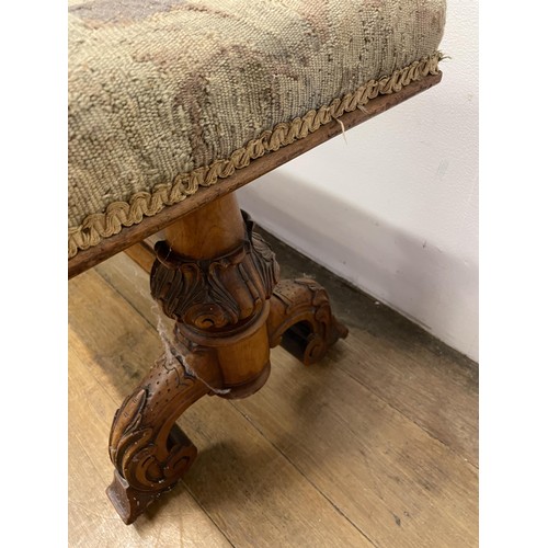 1620 - A 19th century walnut duet stool, with a tapestry seat, 116 cm wide