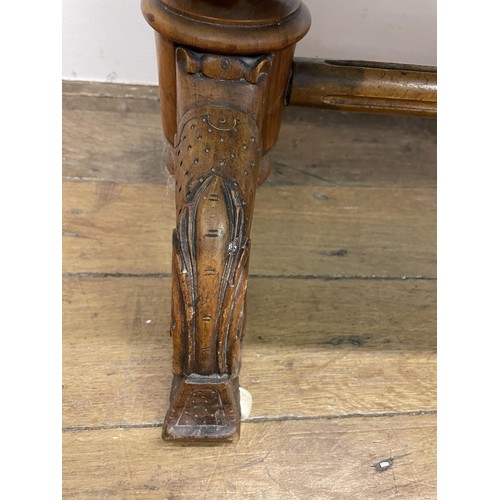 1620 - A 19th century walnut duet stool, with a tapestry seat, 116 cm wide