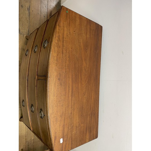 1660 - A mahogany bow front chest, having three drawers, 107 cm wide