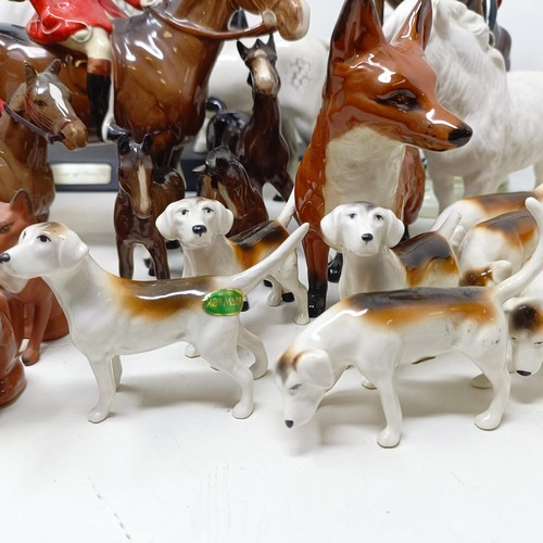 1458 - A Beswick huntsman, another, assorted Beswick horses, Beswick hounds and other Beswick items (qty)