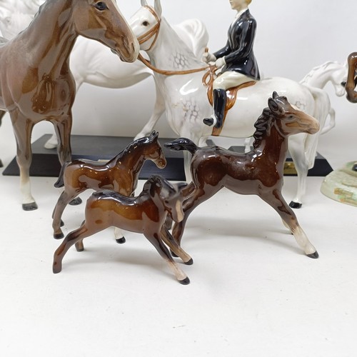 1458 - A Beswick huntsman, another, assorted Beswick horses, Beswick hounds and other Beswick items (qty)