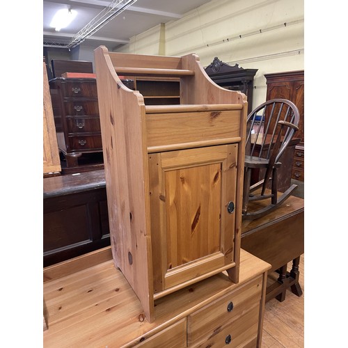 1656 - A pine chest, 90 cm wide, a bedside chest, a set of three bookcases, a trunk, three chairs  and a co... 