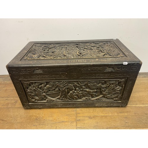 1568 - A Chinese carved camphorwood chest, 115 cm wide