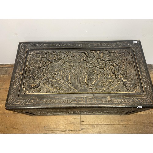 1568 - A Chinese carved camphorwood chest, 115 cm wide