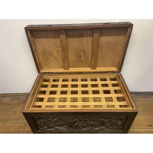 1568 - A Chinese carved camphorwood chest, 115 cm wide