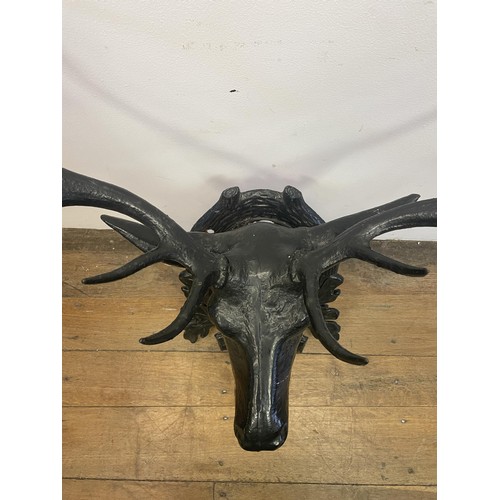 1610 - A cast iron hat stand in the form of a stag's head, 73 cm wide